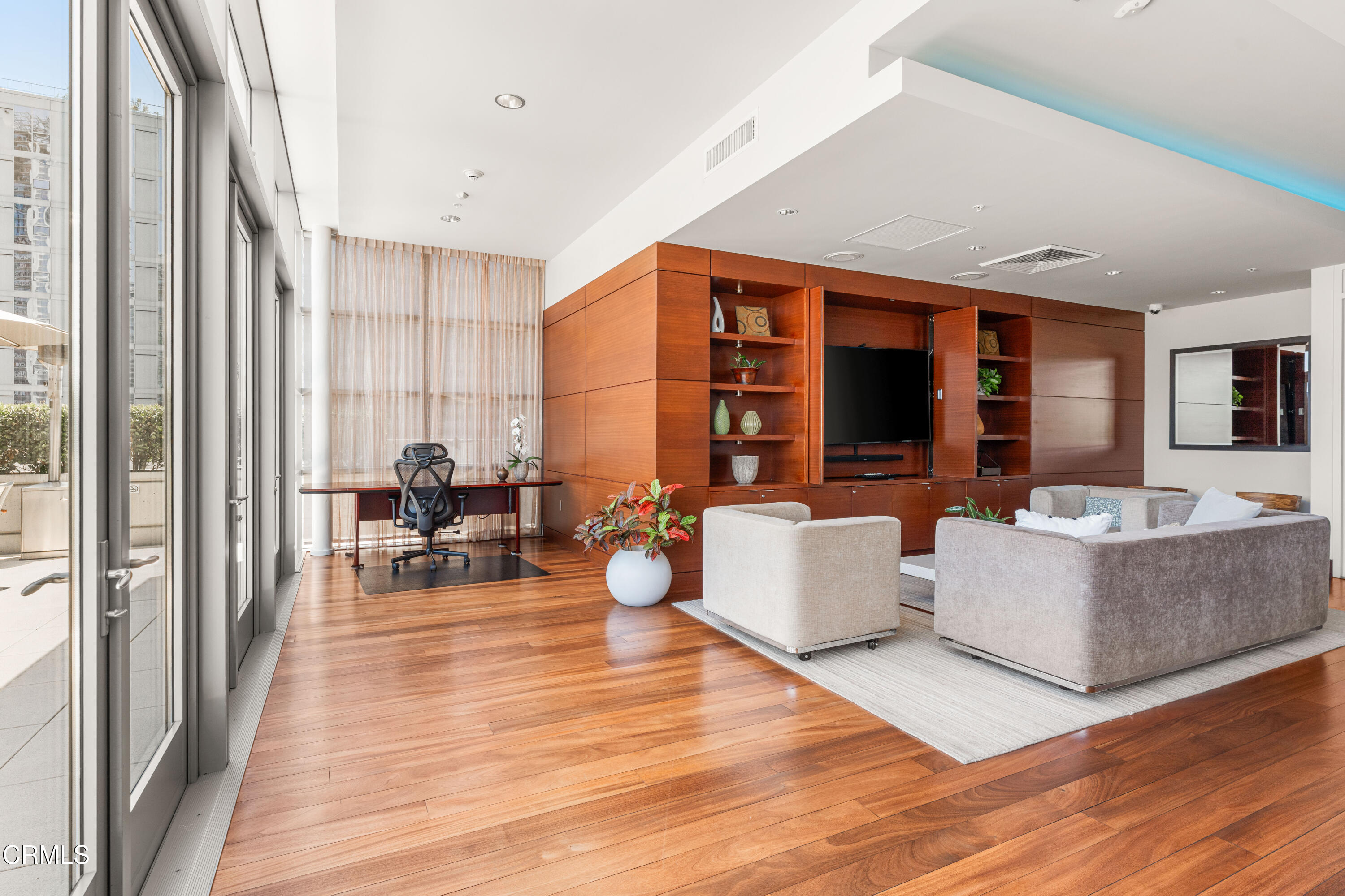 1155 South Grand Avenue, Unit 2106 Los Angeles, CA 90015 - Photo 45 of 51 a living room with furniture and large windows