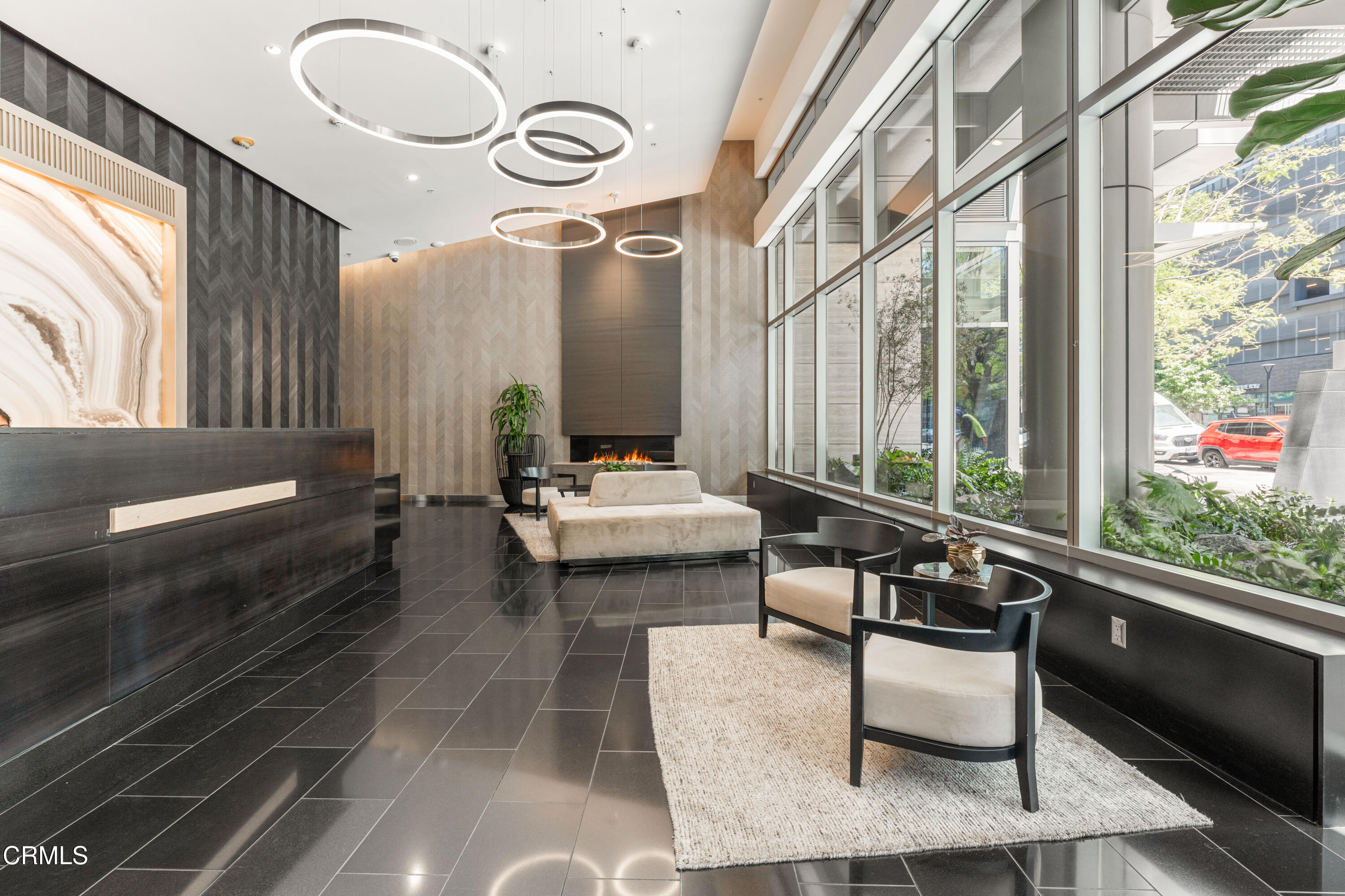 1155 South Grand Avenue, Unit 2106 Los Angeles, CA 90015 - Photo 50 of 51 a living room with patio furniture and a large window