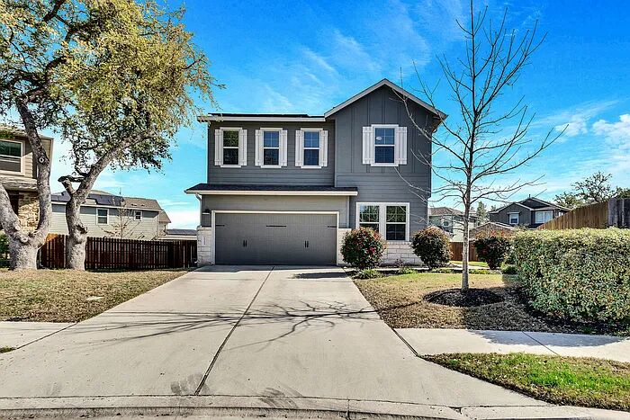 10403 Bramble Berry Drive Austin, TX 78748 - Photo 1 of 21 a front view of a house with a yard