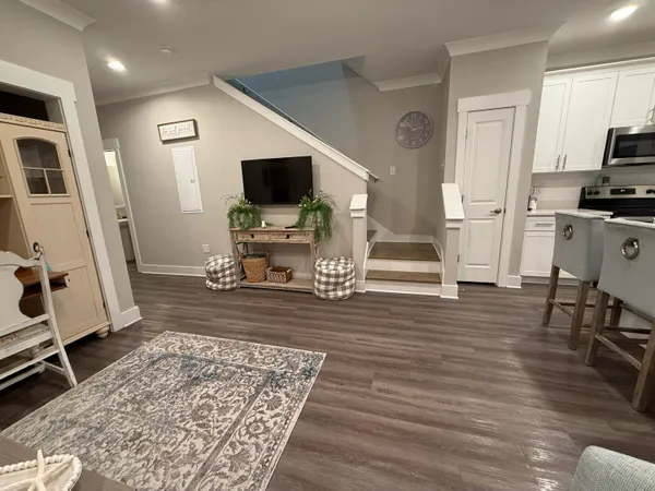 a kitchen with stainless steel appliances a refrigerator and a stove top oven
