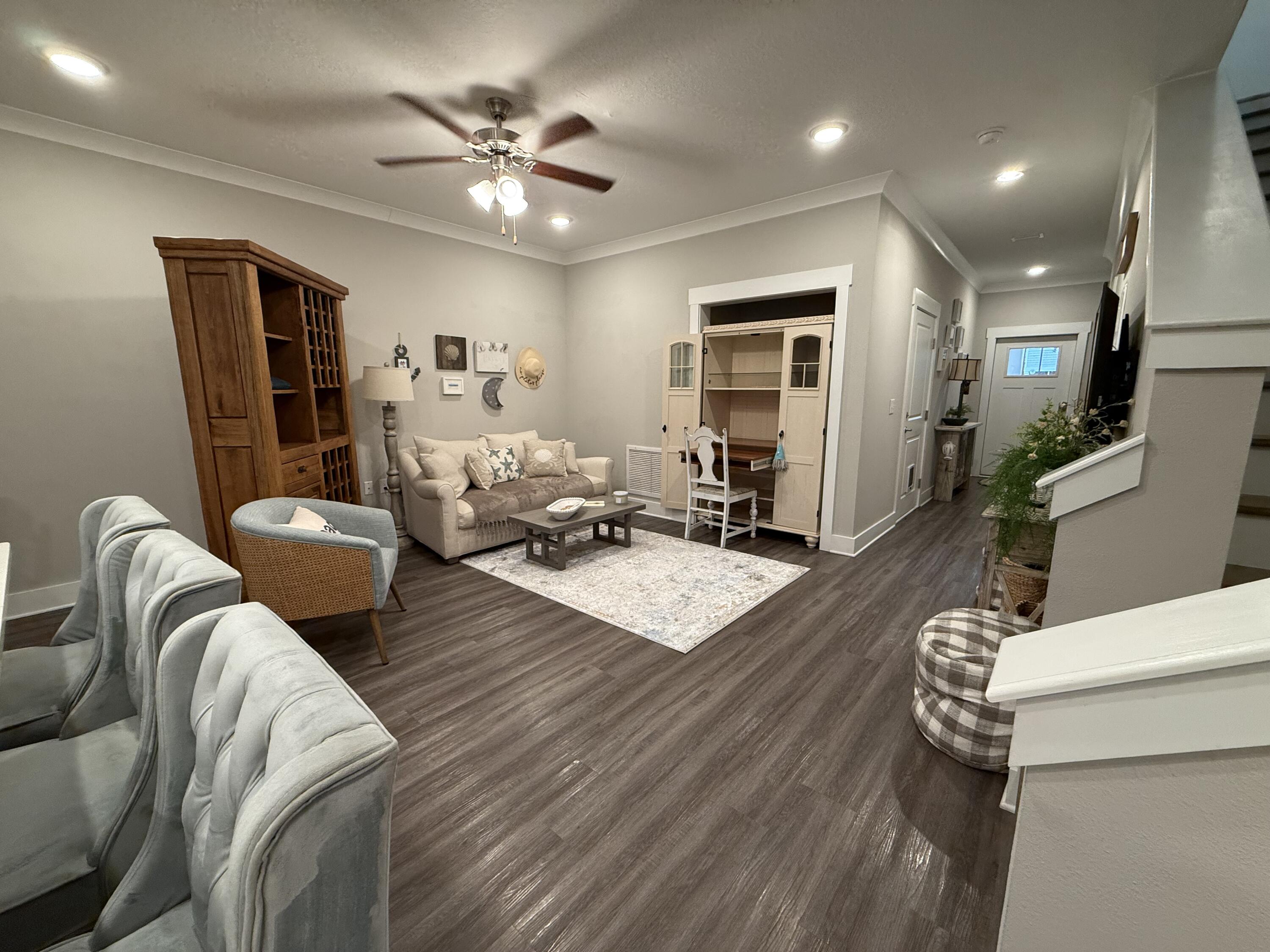 406 Date Palm Lane Freeport, FL 32439 - Photo 17 of 44 a living room with furniture and a chandelier