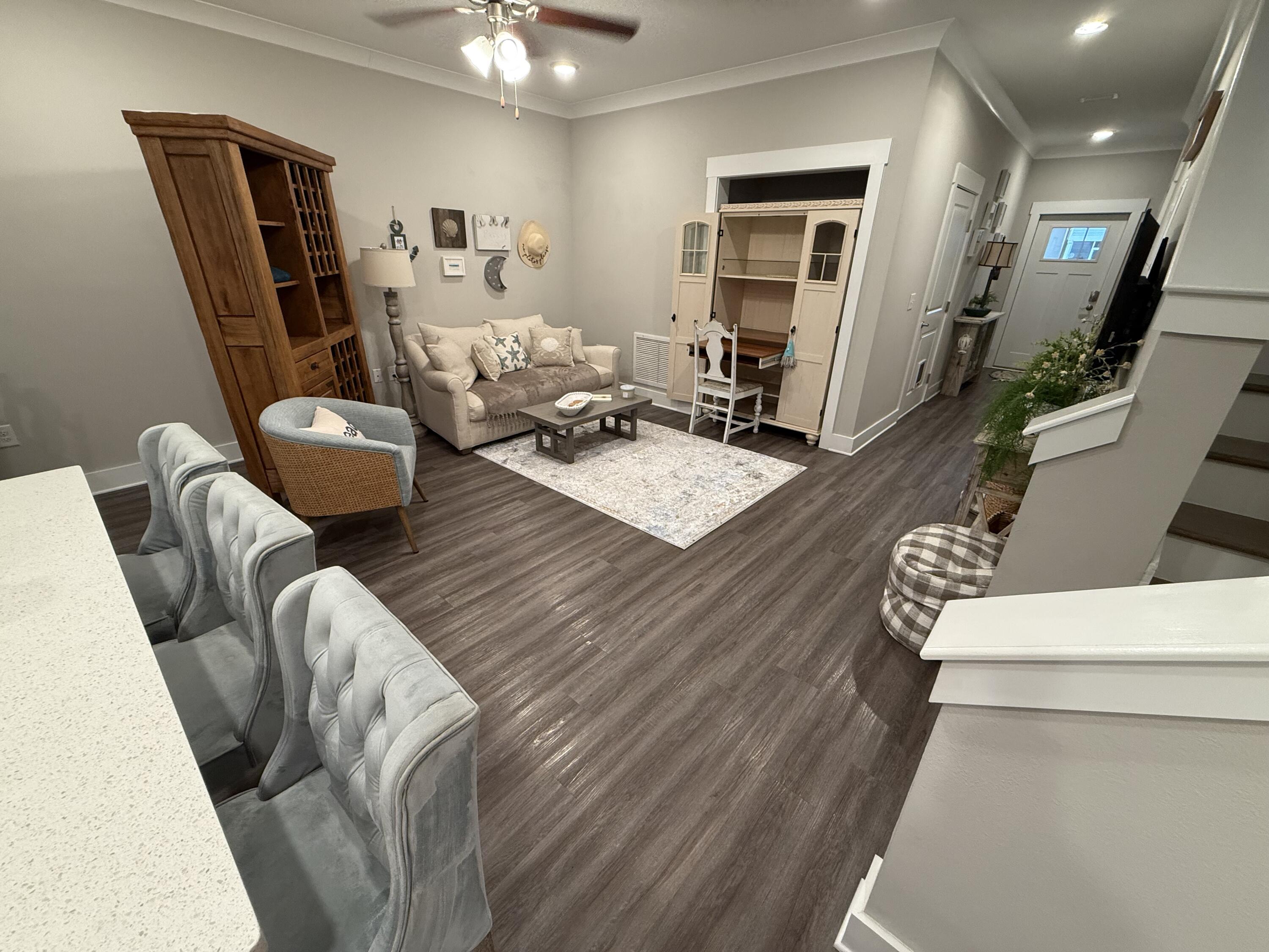 406 Date Palm Lane Freeport, FL 32439 - Photo 18 of 44 a living room with furniture and a wooden floor