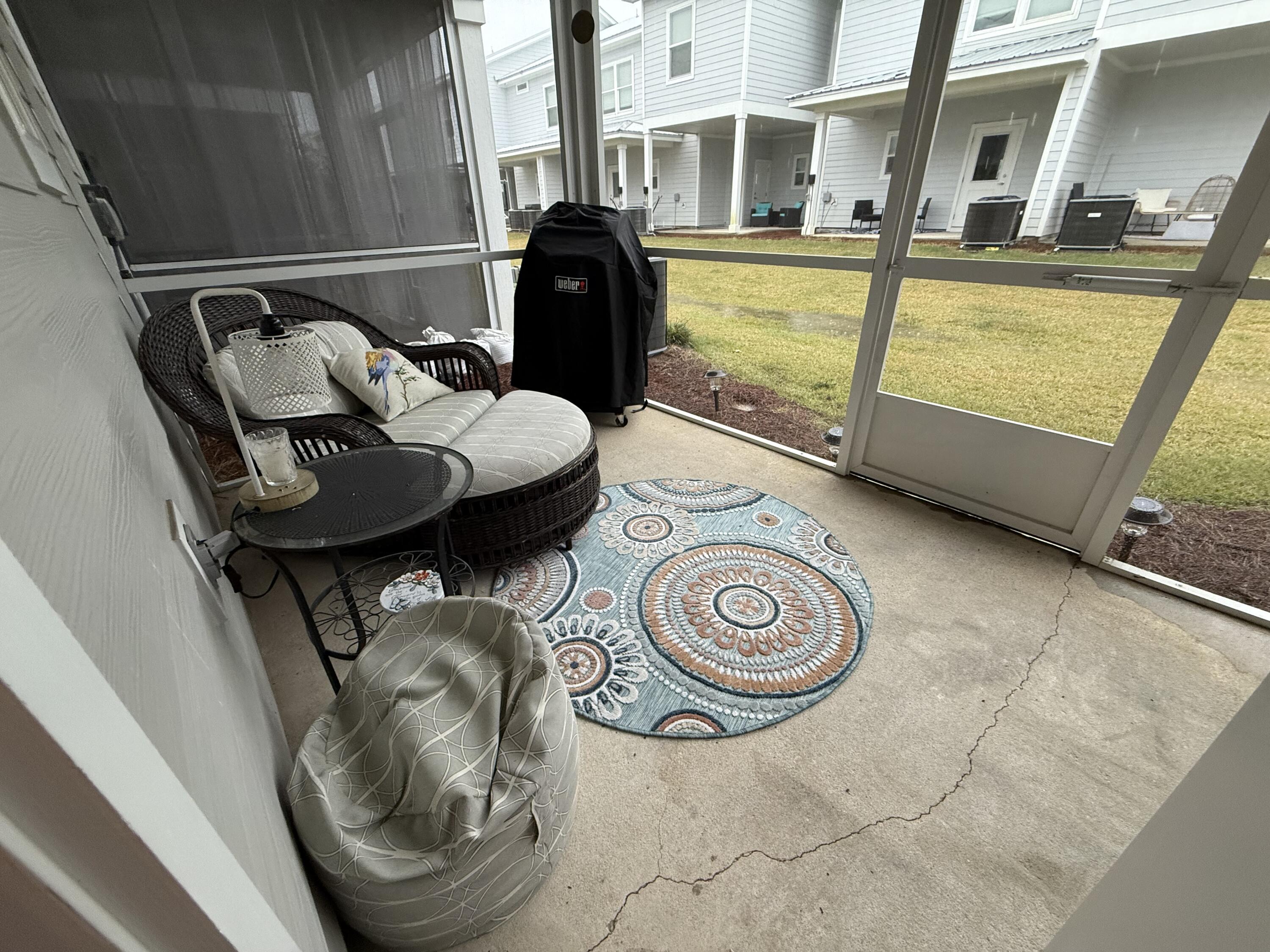 406 Date Palm Lane Freeport, FL 32439 - Photo 19 of 44 a view of a two chairs in the balcony