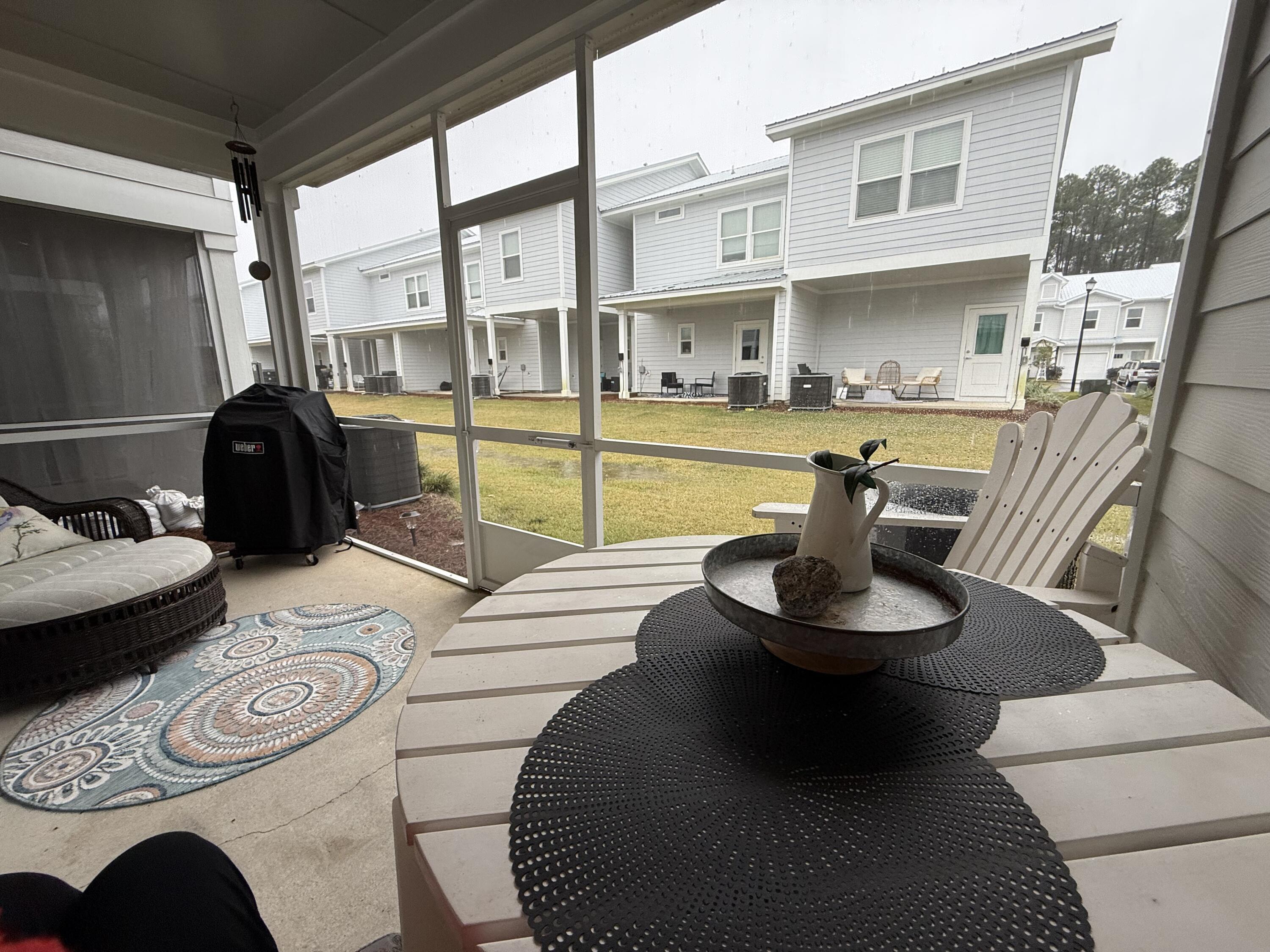 406 Date Palm Lane Freeport, FL 32439 - Photo 21 of 44 a living room with furniture and a table