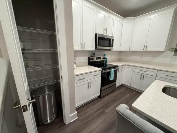 a view of room with walk in closet and window