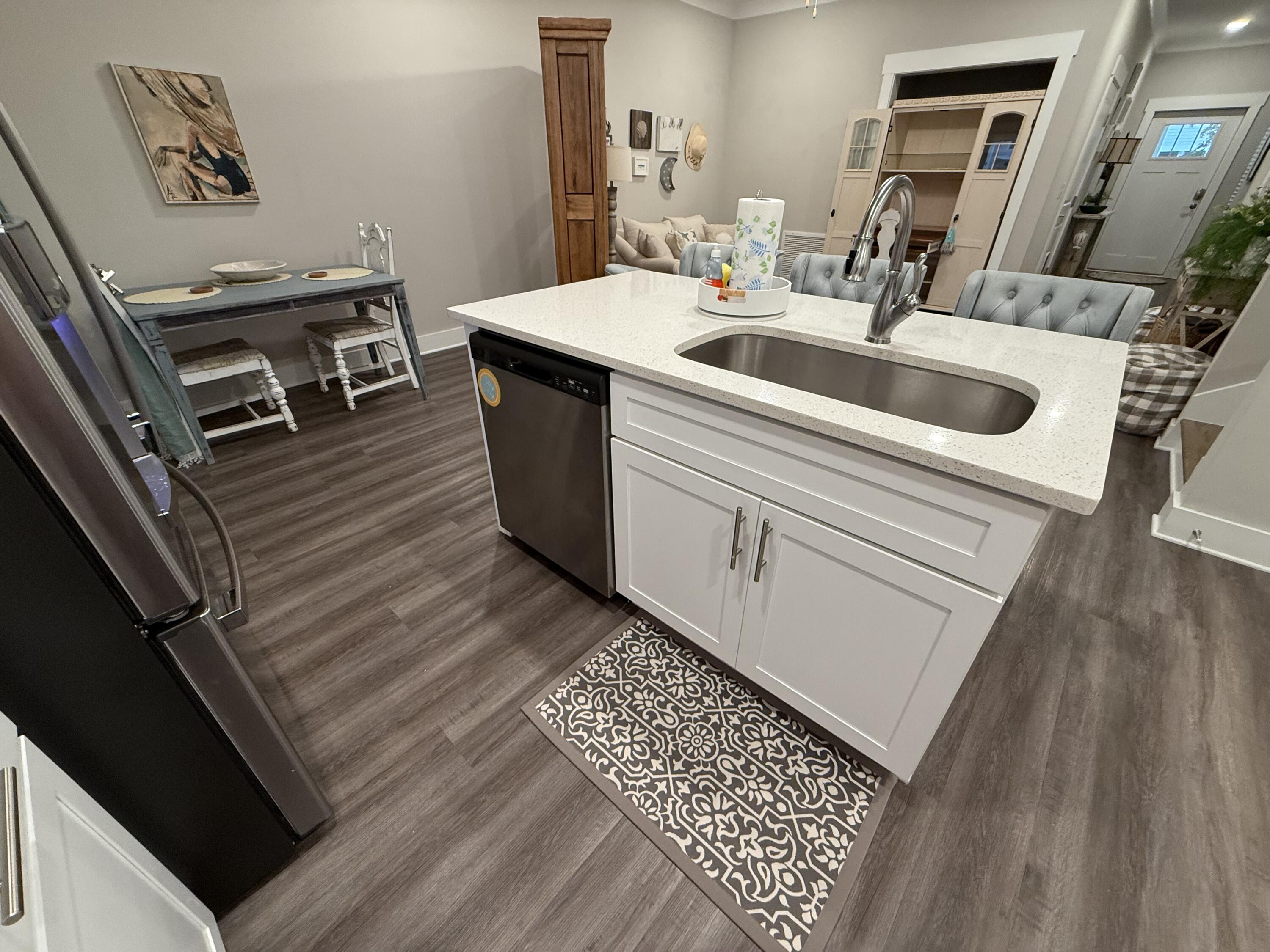 406 Date Palm Lane Freeport, FL 32439 - Photo 24 of 44 a kitchen with a sink and a stove top oven