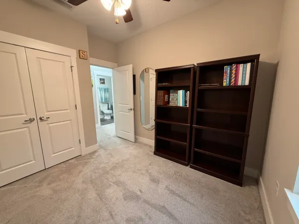a bathroom with a toilet sink vanity tub and shower