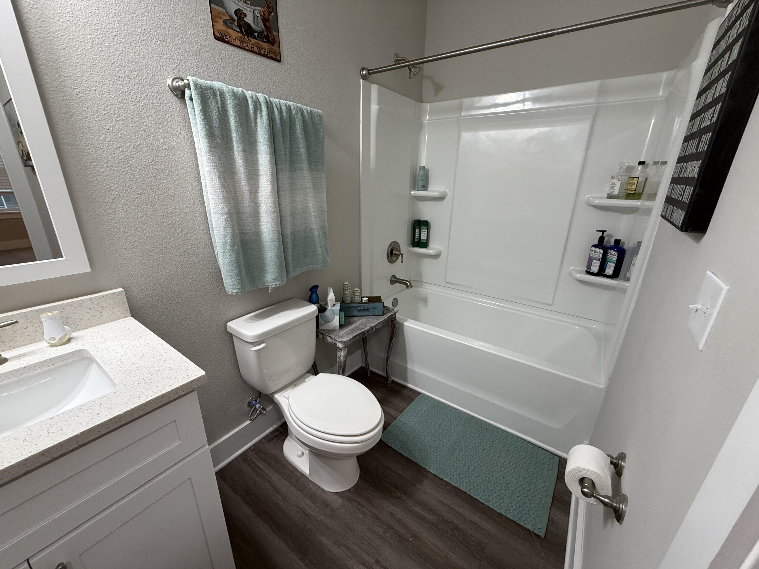 406 Date Palm Lane Freeport, FL 32439 - Photo 32 of 44 a bathroom with a sink toilet and shower