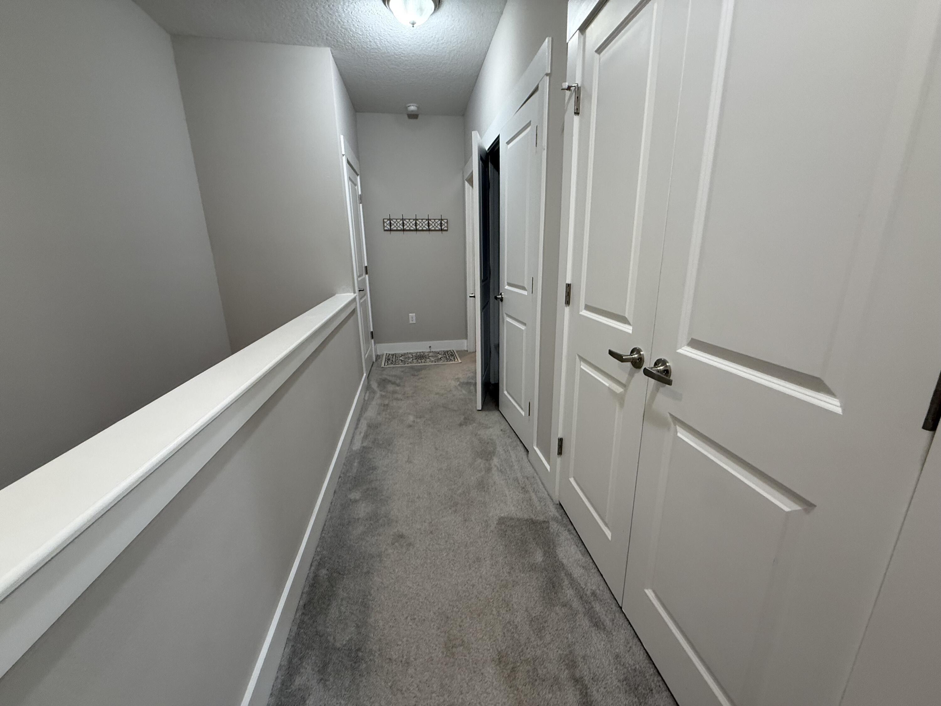 406 Date Palm Lane Freeport, FL 32439 - Photo 33 of 44 a view of hallway with stairs