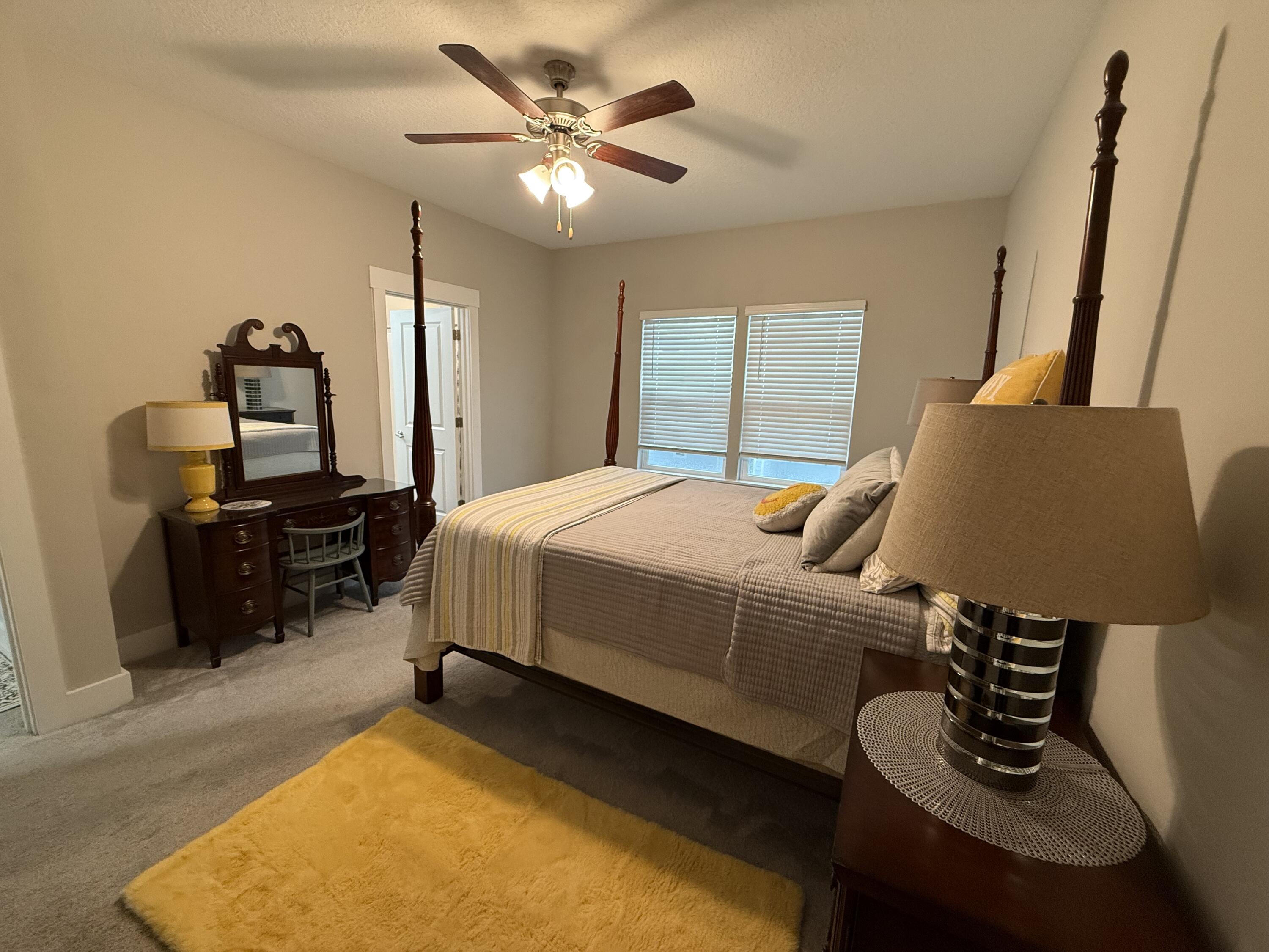 406 Date Palm Lane Freeport, FL 32439 - Photo 37 of 44 a bedroom with bed and a couch