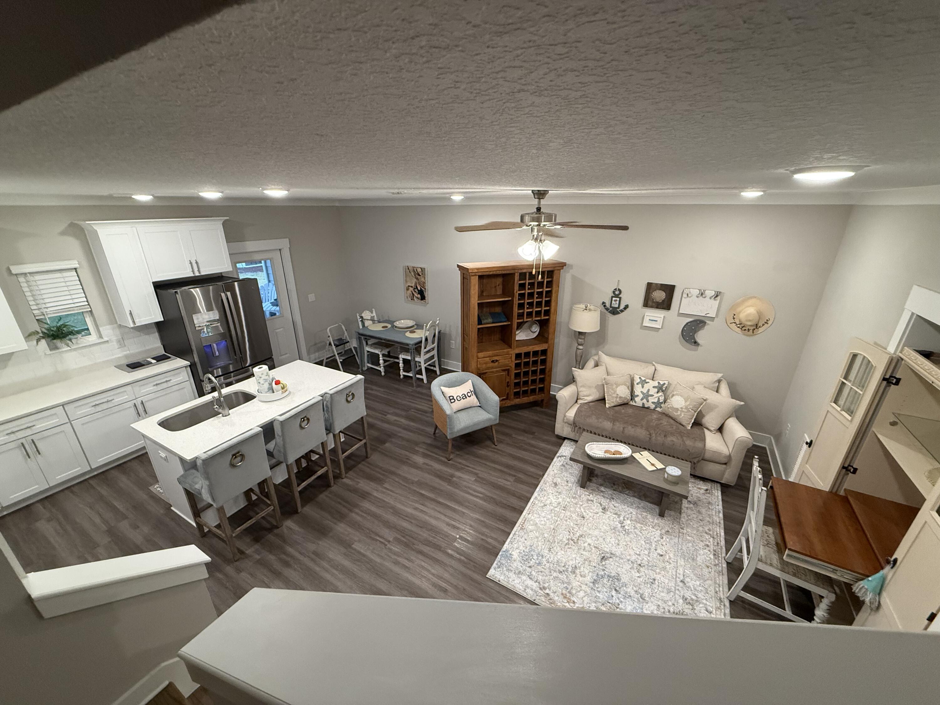 406 Date Palm Lane Freeport, FL 32439 - Photo 42 of 44 a living room with furniture and a table