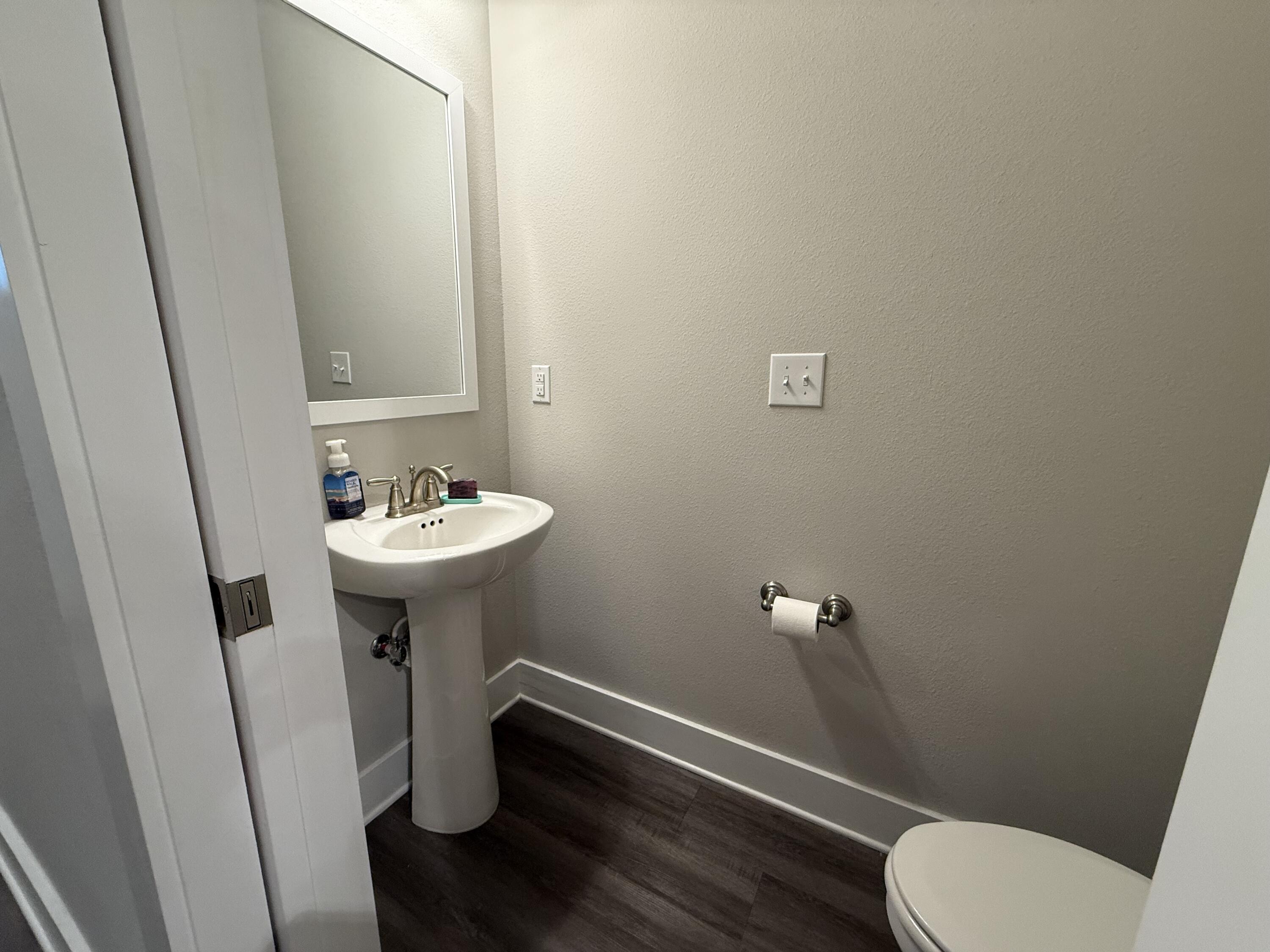 406 Date Palm Lane Freeport, FL 32439 - Photo 5 of 44 a bathroom with a sink a toilet