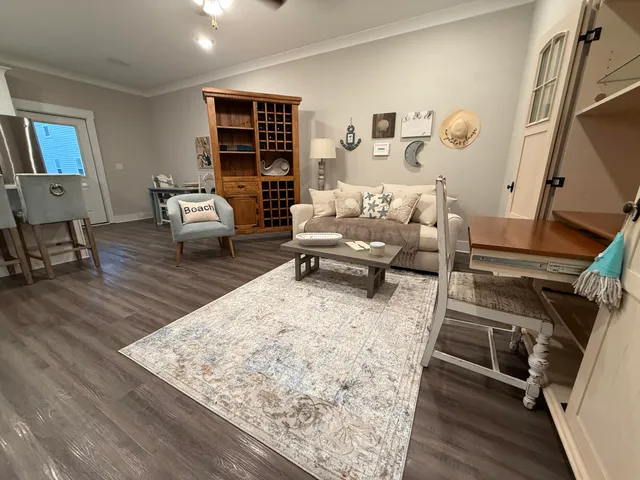 a kitchen with refrigerator a sink a stove a refrigerator cabinets and wooden floor