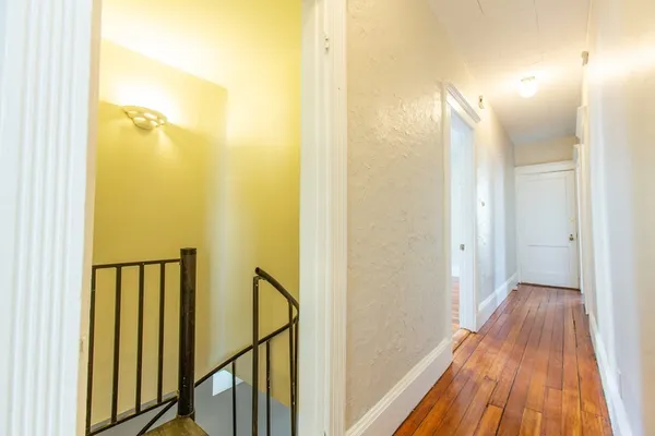 a view of a bathroom from a hallway