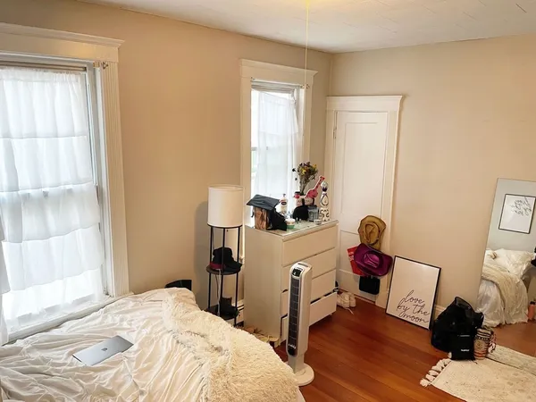 a bedroom with a workspace
