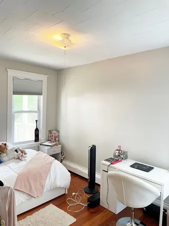 a room with a bed a table and chair