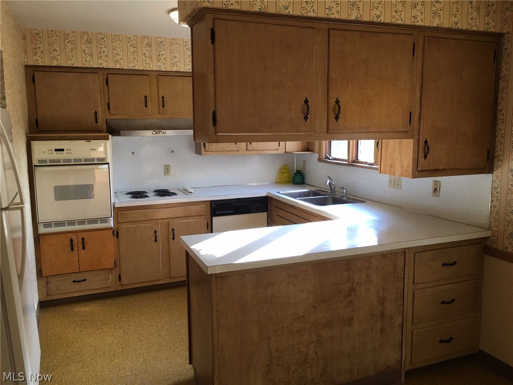 Built in appliance kitchen with lots of storage.