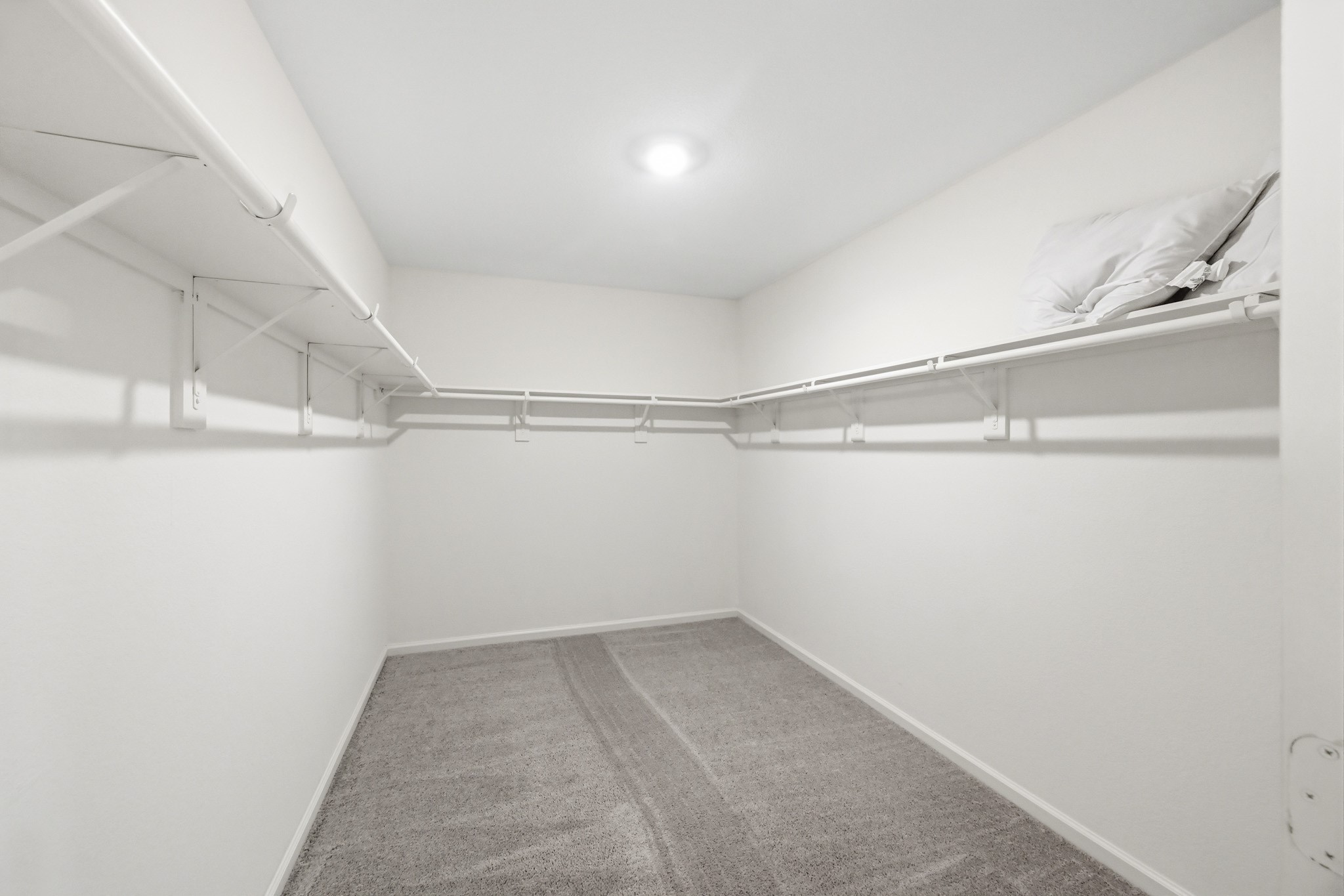 7207 Evitale Way Houston, TX 77049 - Photo 34 of 43 a view of a room with racks on the wall