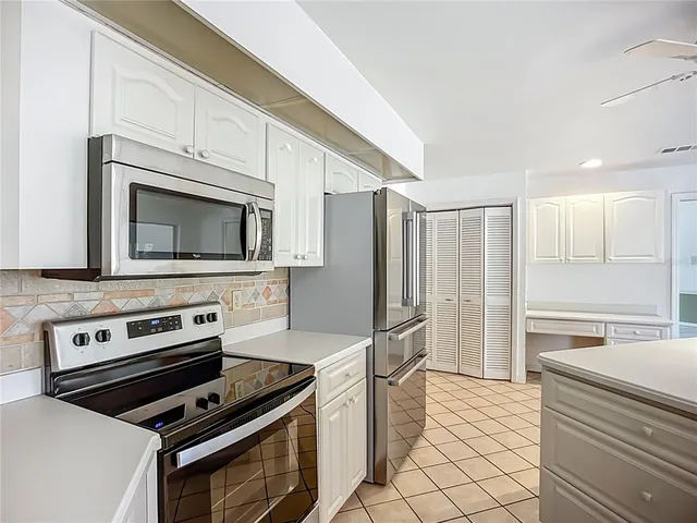 a kitchen with a stove microwave and refrigerator