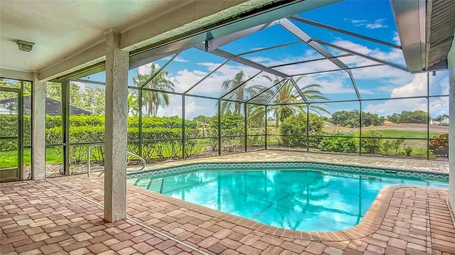 a view of a swimming pool with a yard