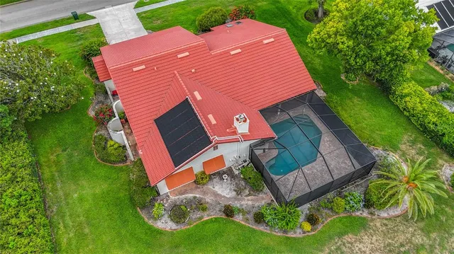 a view of a house with a yard and sitting area