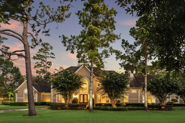 an aerial view of a house with a yard basket ball court and outdoor seating