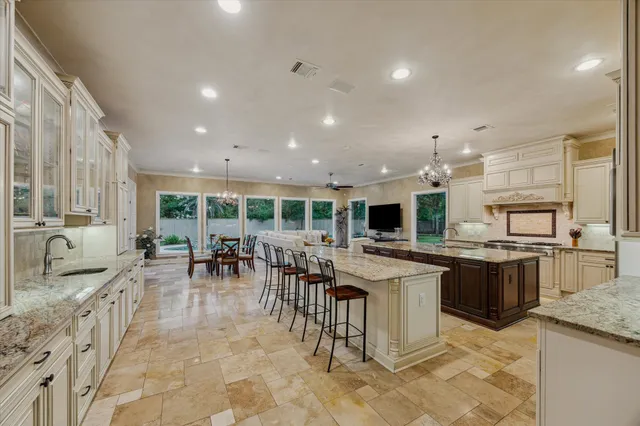 a spacious bathroom with a double vanity sink a large mirror and a shower