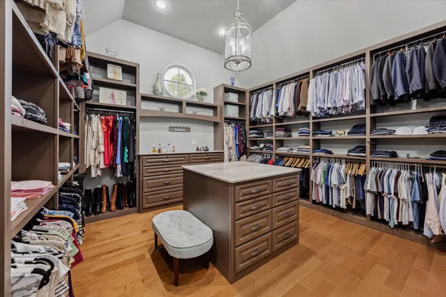 a bathroom with a shower sink vanity and a toilet