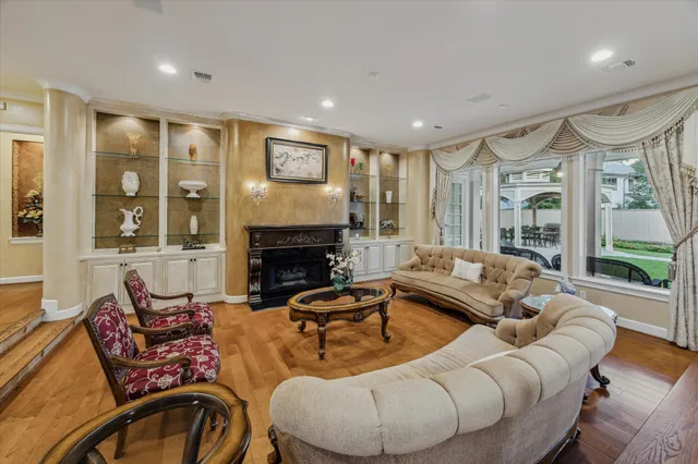 a view of a dining room with furniture and chandelier