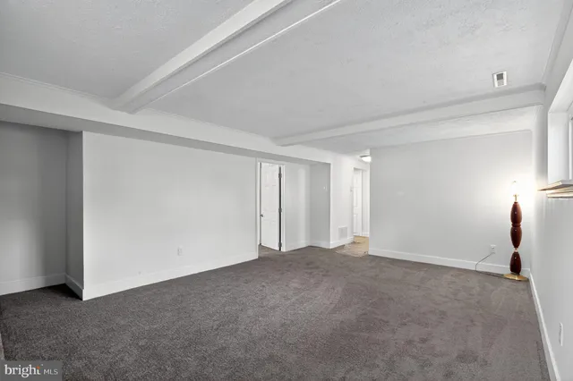 a balcony with wooden floor and fence