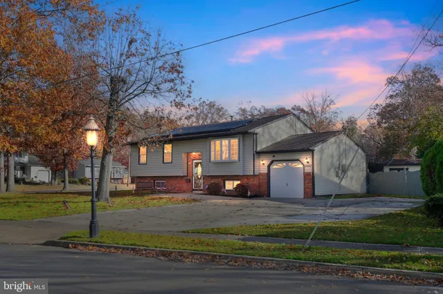 a kitchen with stainless steel appliances granite countertop a stove a sink dishwasher a refrigerator and a microwave oven