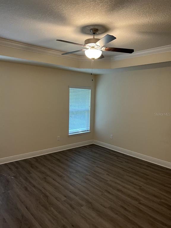 10 Diamond Ridge Way Ocala, FL 34472 - Photo 11 of 13 a view of an empty room with wooden floor and a window