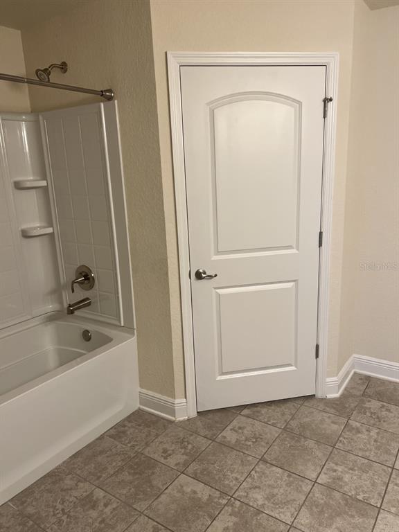 10 Diamond Ridge Way Ocala, FL 34472 - Photo 12 of 13 a bathroom with a bathtub