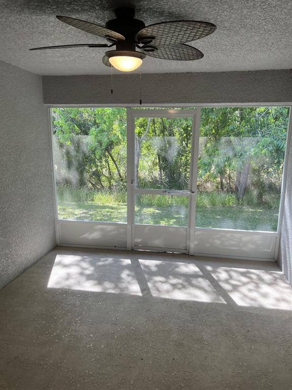 10 Diamond Ridge Way Ocala, FL 34472 - Photo 13 of 13 a view of empty room with wooden floor and fan