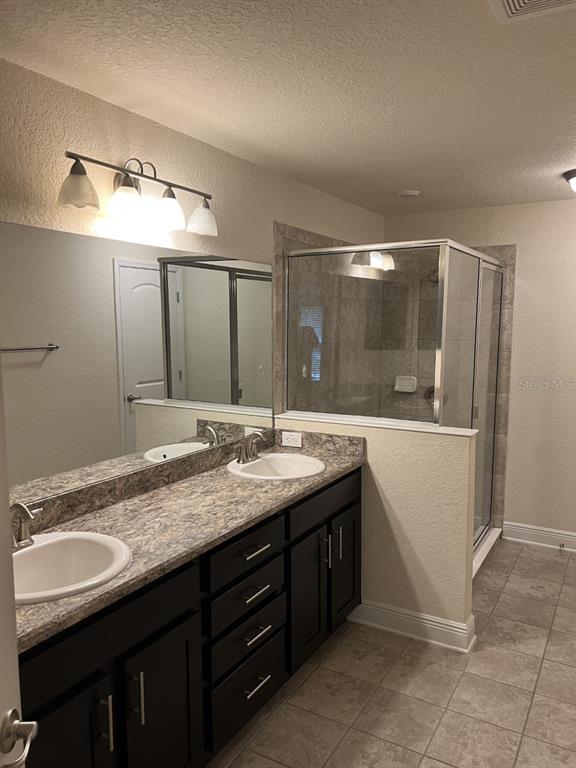 10 Diamond Ridge Way Ocala, FL 34472 - Photo 9 of 13 a bathroom with a granite countertop sink and a mirror