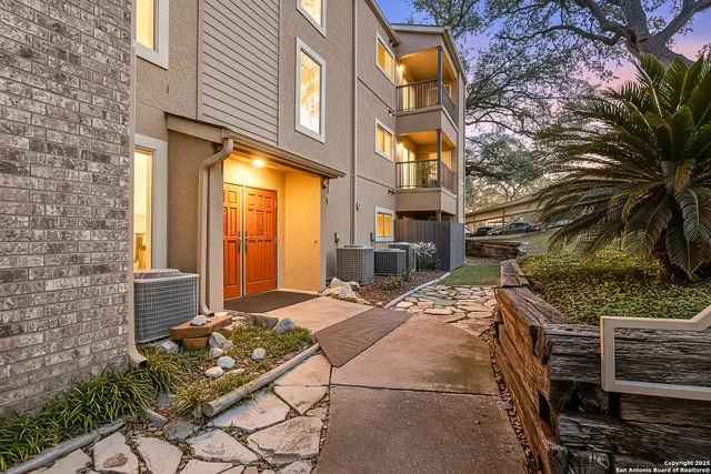 a outdoor space with couple of cars parked on road