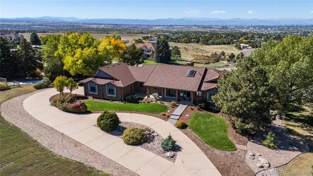 an aerial view of a house with garden space and outdoor space