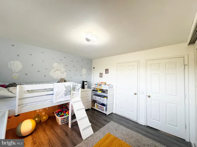 a workspace with furniture and wooden floor