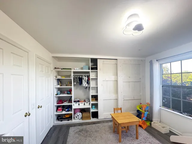 a reading room with furniture and a book shelf
