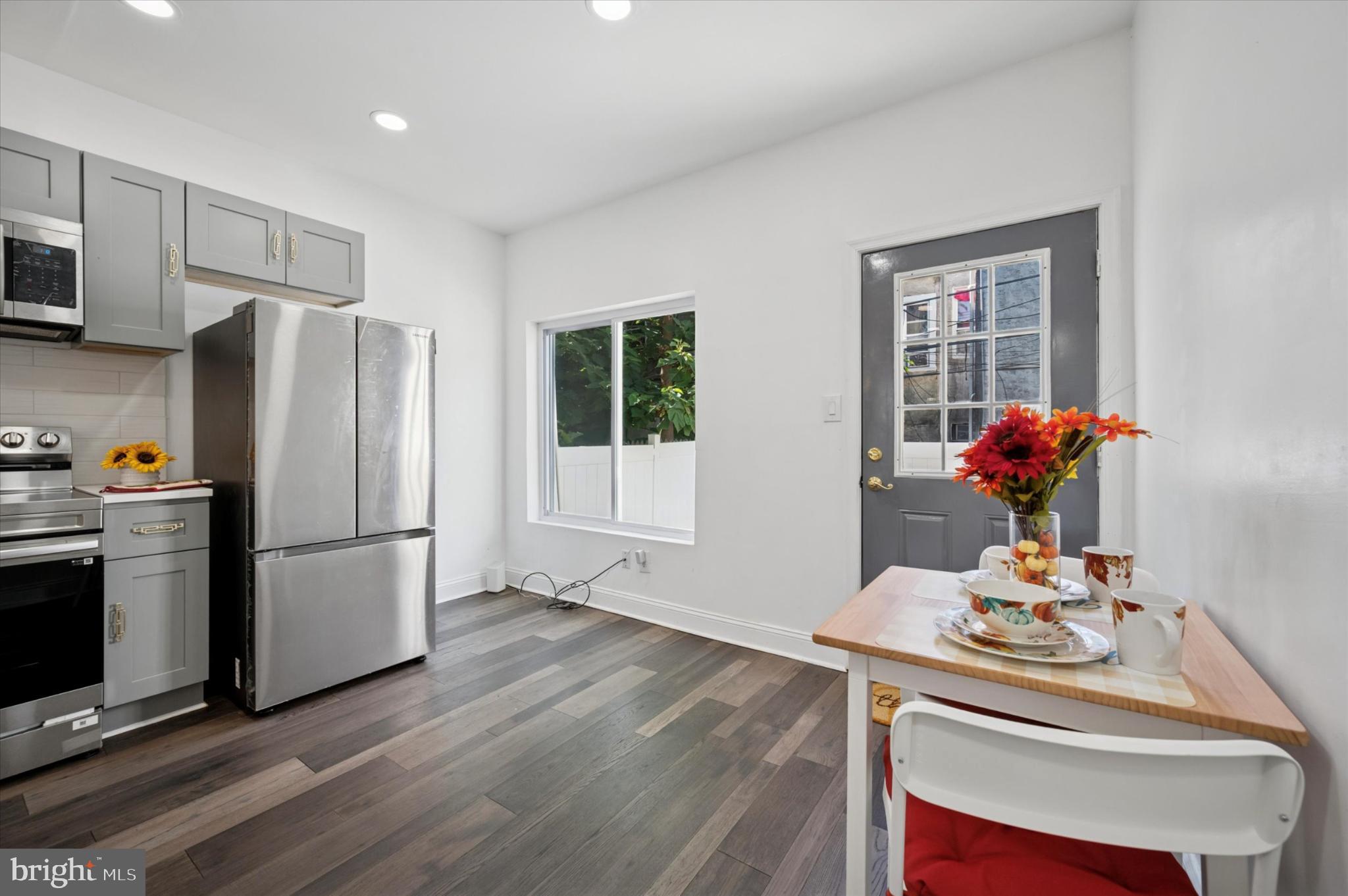 650 East Wensley Street Philadelphia, PA 19134 - Photo 11 of 24 a kitchen with stainless steel appliances a refrigerator sink and wooden floor