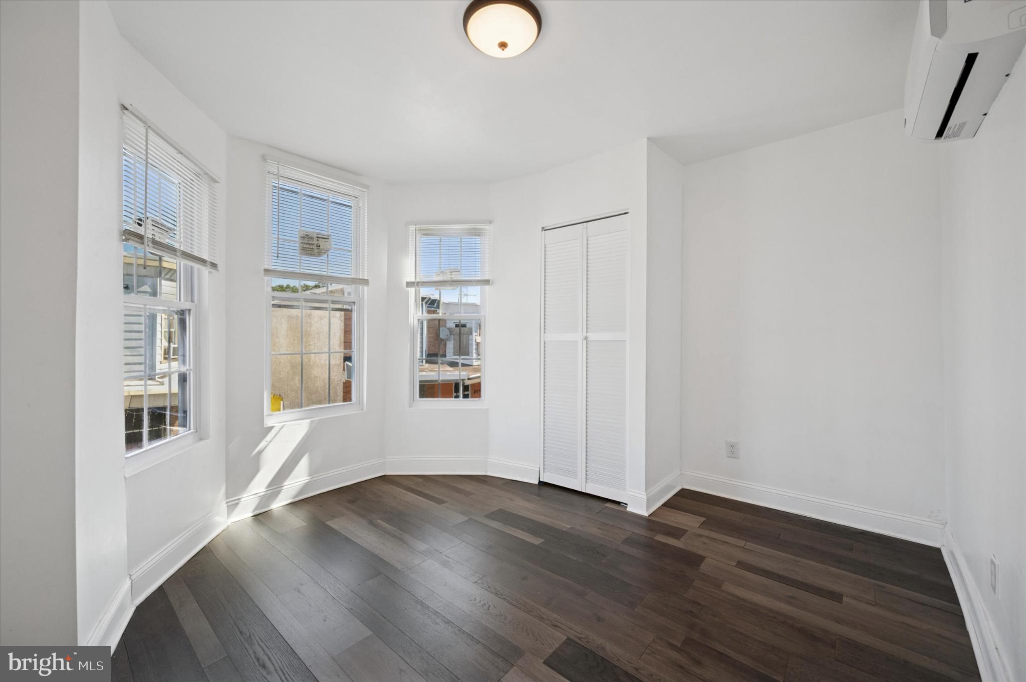 650 East Wensley Street Philadelphia, PA 19134 - Photo 13 of 24 a view of empty room with wooden floor and fan