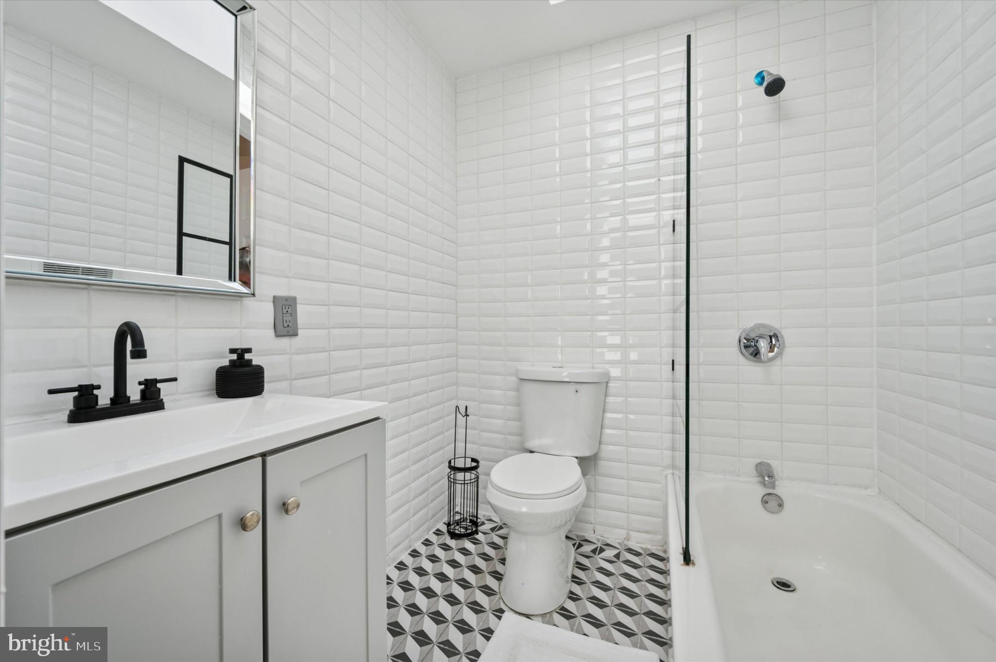 650 East Wensley Street Philadelphia, PA 19134 - Photo 15 of 24 a bathroom with a sink toilet a mirror and shower