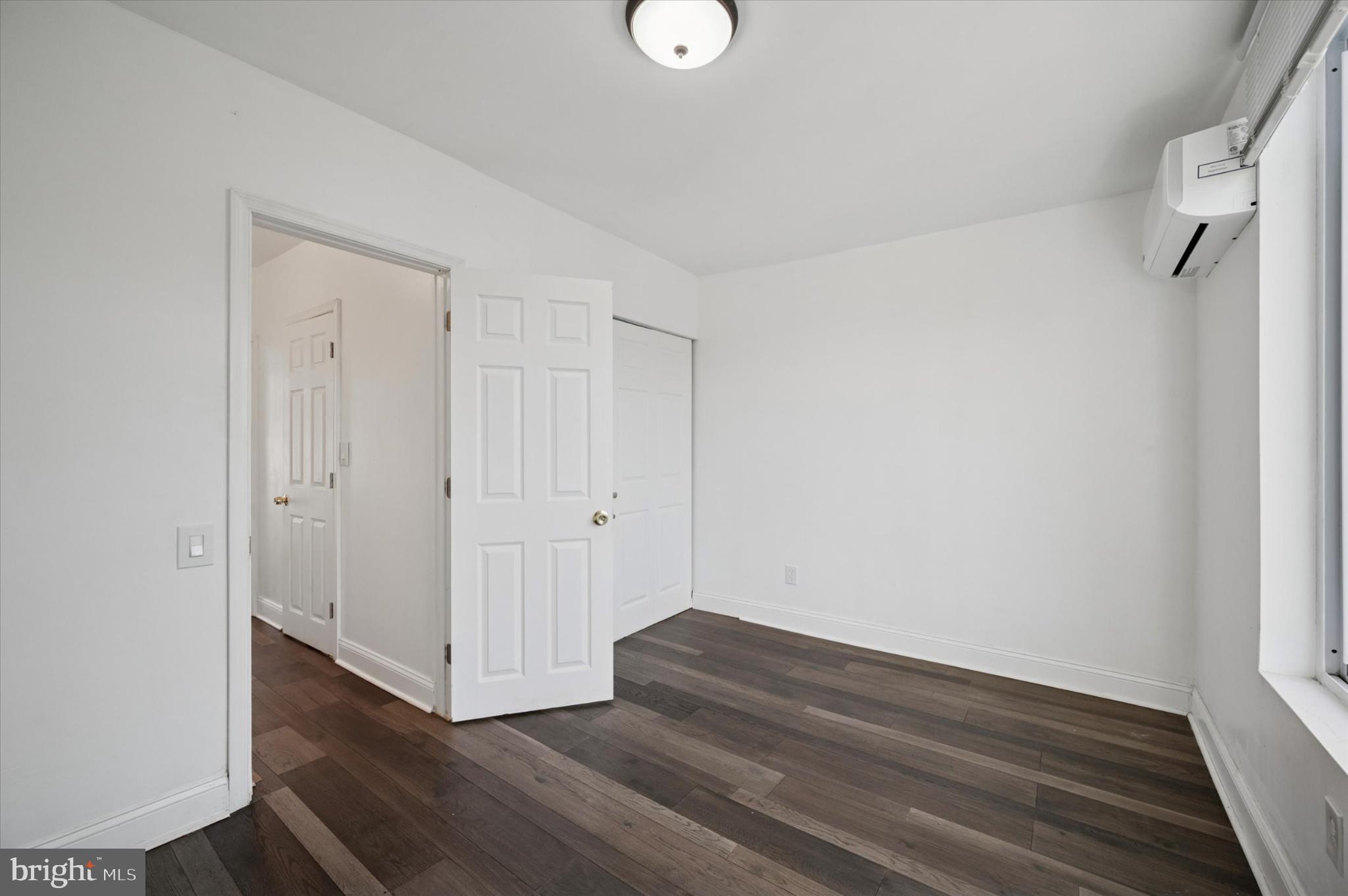 650 East Wensley Street Philadelphia, PA 19134 - Photo 19 of 24 a view of an empty room with wooden floor and a window