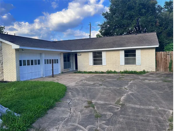 a backyard of a house with yard and garage