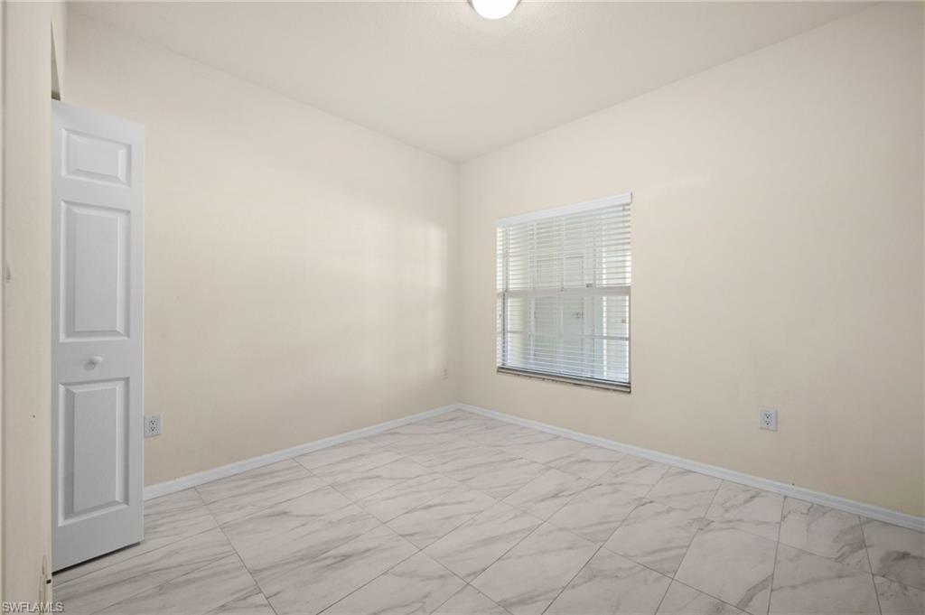 4520 Botanical Pl Circle, Unit 103 Naples, FL 34112 - Photo 13 of 19 Sunny 2nd bedroom w/ walk in closet