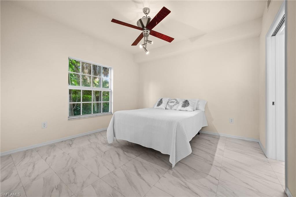 4520 Botanical Pl Circle, Unit 103 Naples, FL 34112 - Photo 10 of 19 Master bedroom