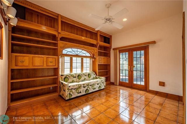 a bathroom with a toilet shower vanity and a sink