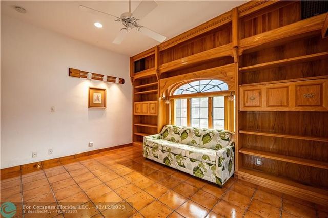a bathroom with a granite countertop toilet a sink and shower