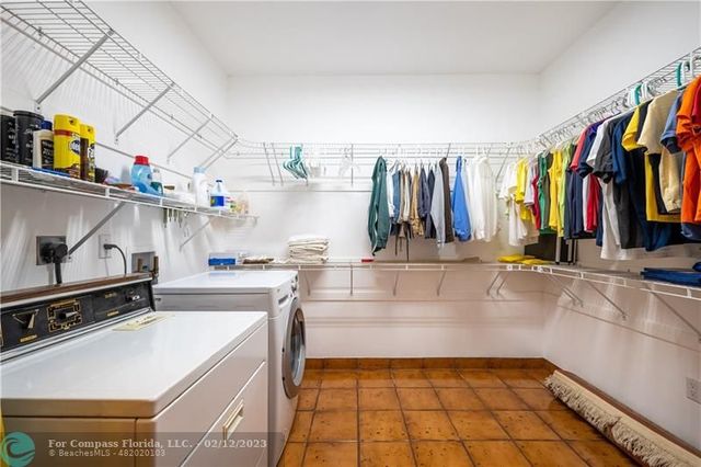 a view of a patio with couches and pool