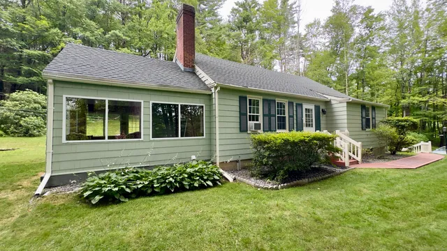 a view of a house with a garden